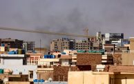 Smoke billows over residential buildings in eastern Khartoum on April 22, 2023, during ongoing battles between the forces of two rival generals. - Fighting in Sudan's capital entered a second week today as crackling gunfire shattered a temporary truce, the latest battles between forces of rival generals that have already left hundreds dead and thousands wounded. (Photo by AFP) (Photo by -/AFP via Getty Images)