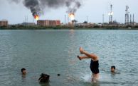 Iraqi youths swim in the Shatt al-Arab waterway at the end of a hot summer day in the southern Iraqi city of Basra on August 11, 2023. (Photo by Hussein Faleh / AFP) (Photo by HUSSEIN FALEH/AFP via Getty Images)