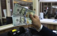 An employee counts banknotes at currency exchange shop in Baghdad on February 14, 2023. - Iraq nudged up the value of its local currency against the dollar in an effort to stabilise the dinar after tougher foreign transfer regulations sent its value fluctuating. The government adopted a new official exchange rate, fixing it at 1,300 dinars to the US dollar instead of 1,470, the prime minister's office said. (Photo by Murtaja LATEEF / AFP) (Photo by MURTAJA LATEEF/AFP via Getty Images)