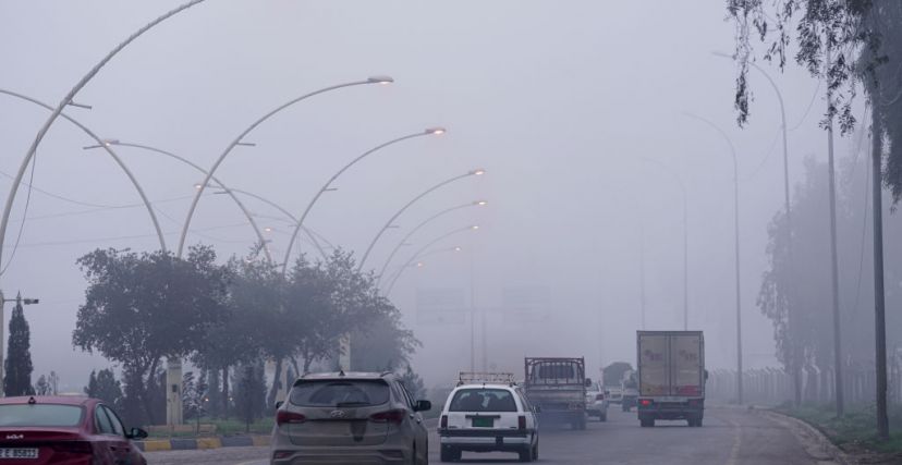 MOSUL, IRAQ - JANUARY 03: Vehicles are seen on their way during foggy weather in Mosul, Iraq on January 03, 2024. (Photo by Ismael Adnan Yaqoob/Anadolu via Getty Images)
